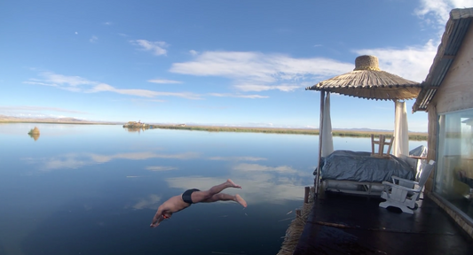 Diving in to swim in Lake Titicaca