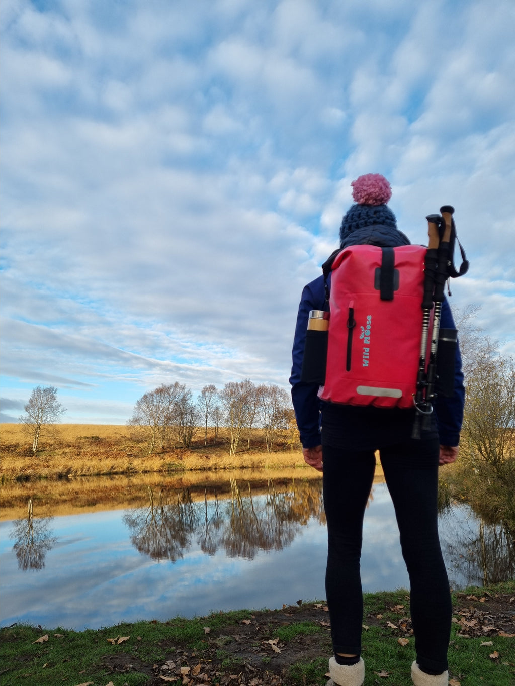 Wild Swimmer wearing bright pink waterproof swim backpack by Wild Moose, by Winter Wild Swim Spot.
