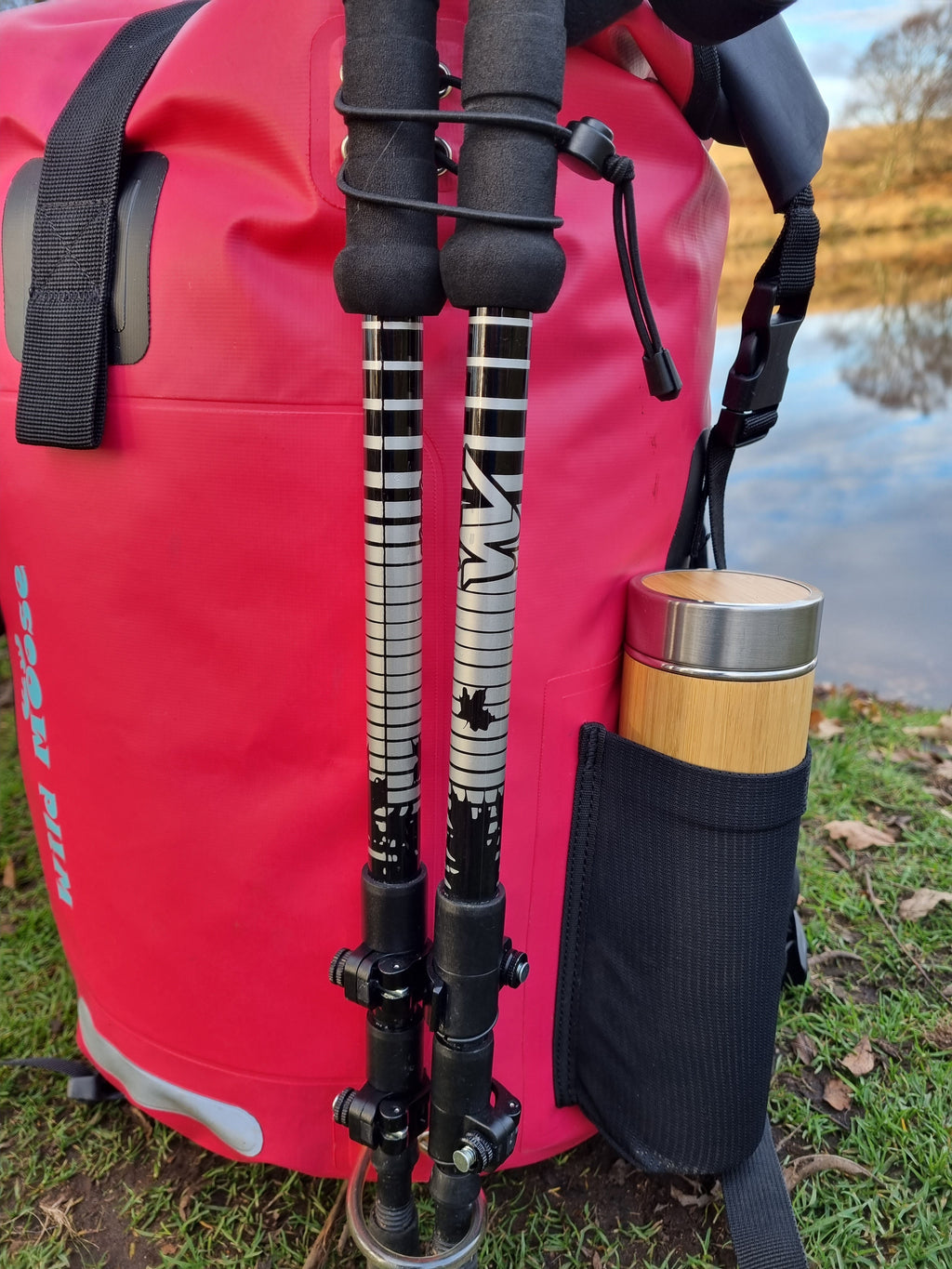 Close-up shot of a bright pink waterproof 45L backpack by Wild Moose, designed for wild swimmers, cold water swimmers, and open water adventurers.