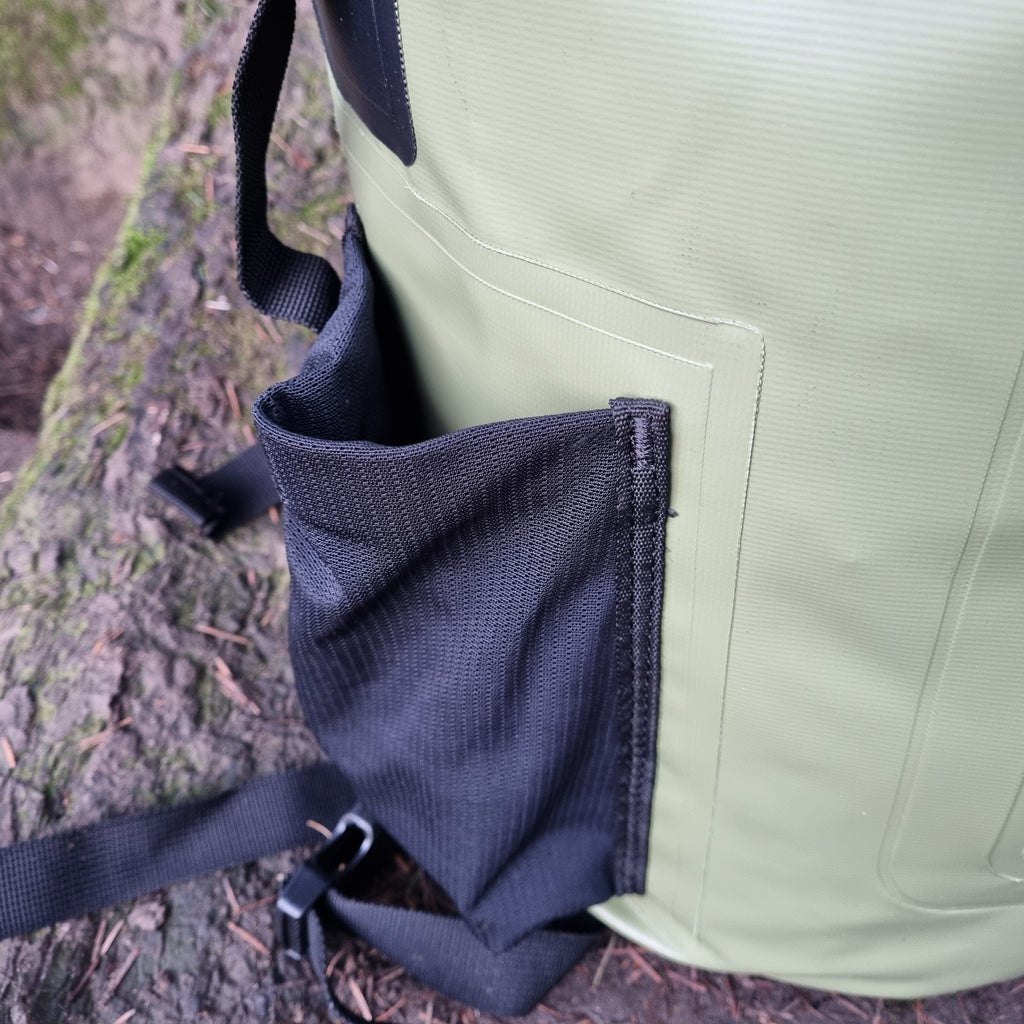 Close up of mesh pocket on the side of a Green Waterproof Swim Bag.