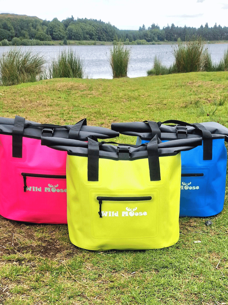 Waterproof swim bags in bright colours, designed for wild swimming adventures