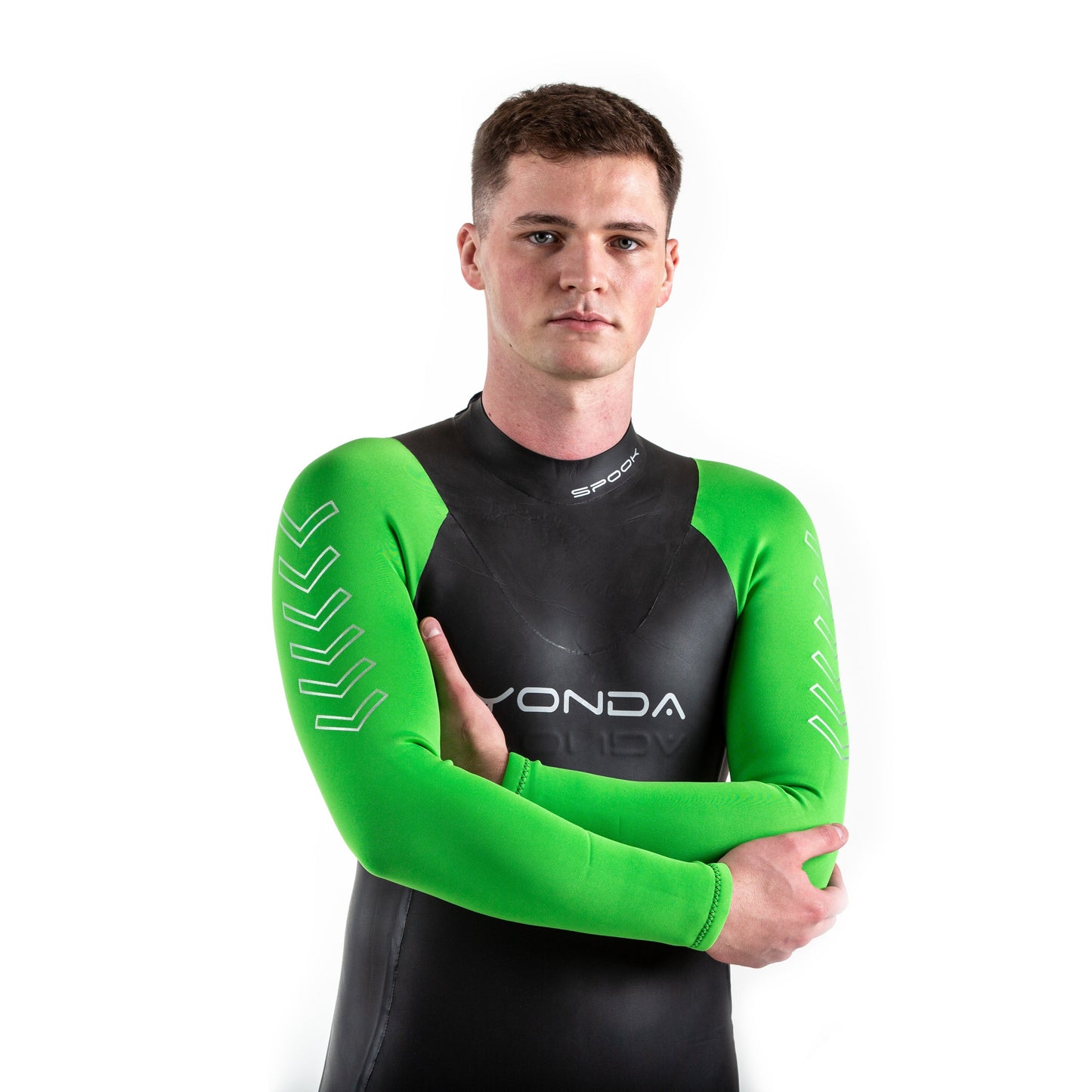 Man with arms crossed, facing the camera. He is wearing the Spook Wetsuit by Yonda. It has bright green arm sleeves.