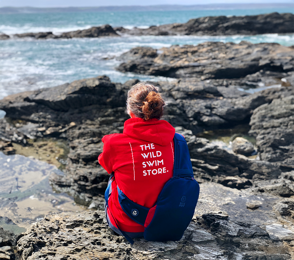 Sitting on rocks with the Snug Bud