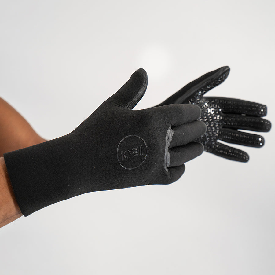 Fourth Element - 3mm Neoprene Wild Swimming Gloves on a person's hands